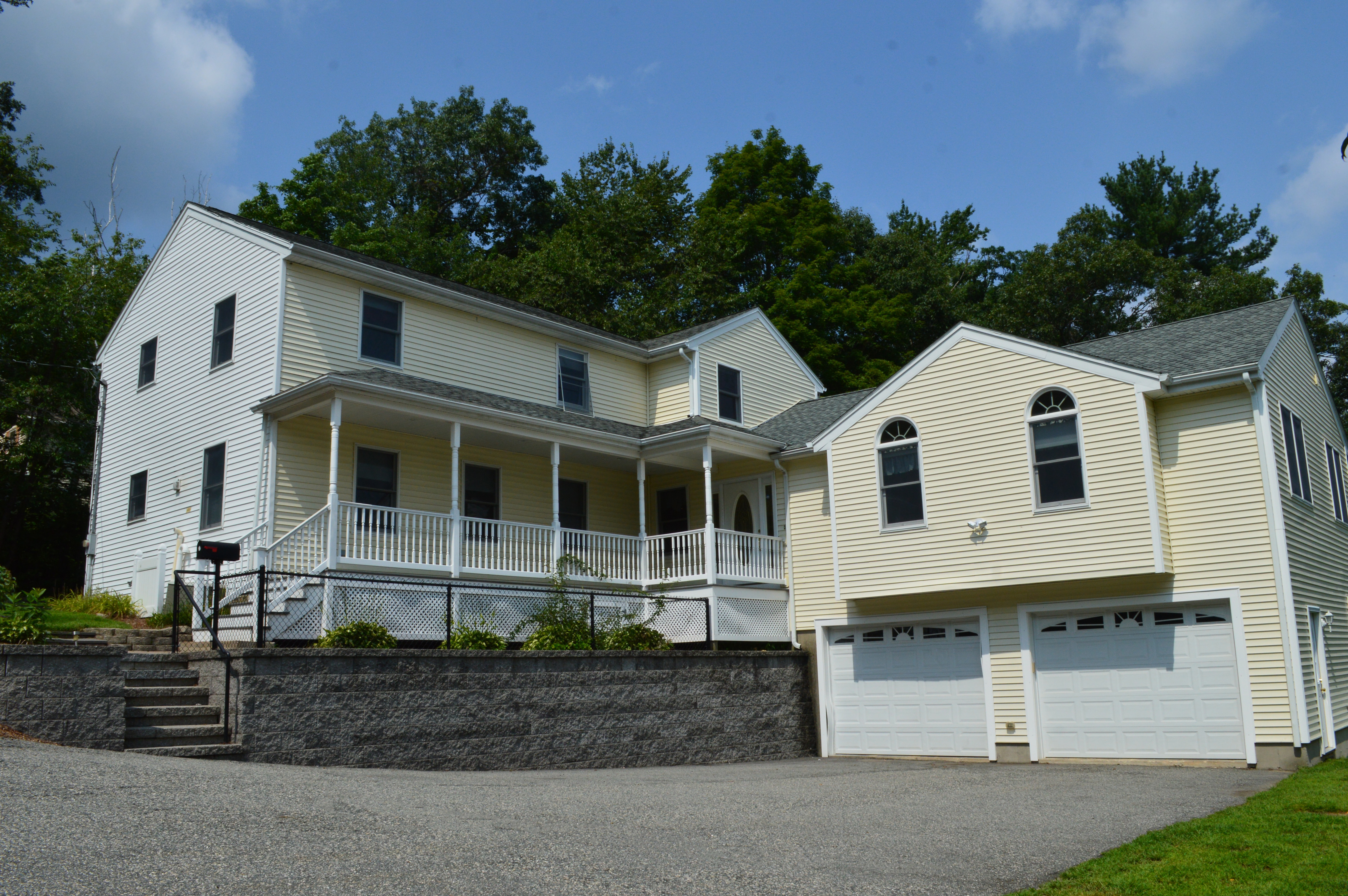 Burlington House is a large, light yellow, family home with a garage and two floors.