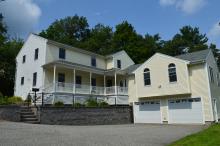 Burlington House is a large, light yellow, family home with a garage and two floors.